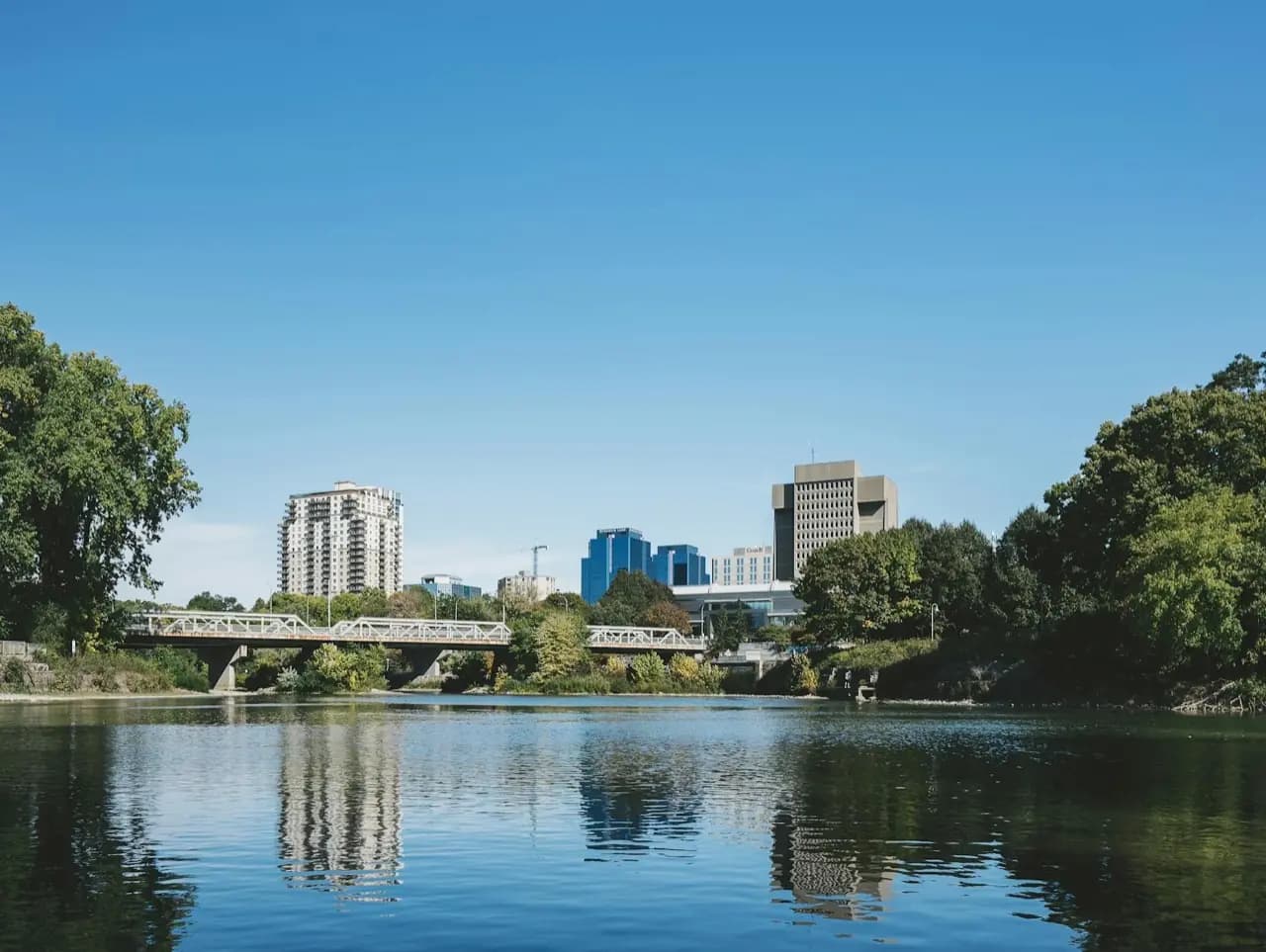 Guelph, Ontario Speed River with downtown skyline — cobbler and shoe repair service area